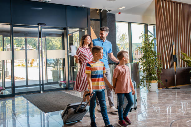 guests walking into a hotel lobby used on a blog about hotel price compliance